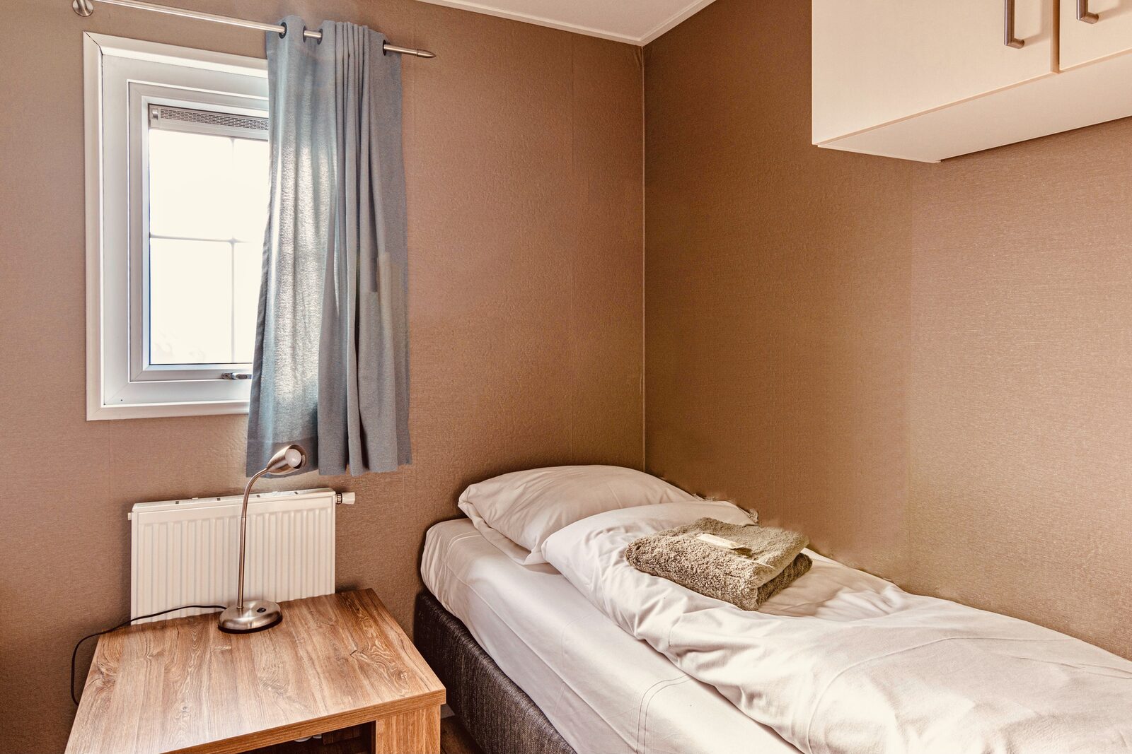 Chalet "De Kleine Belter" für vier Personen mit einer Holzveranda