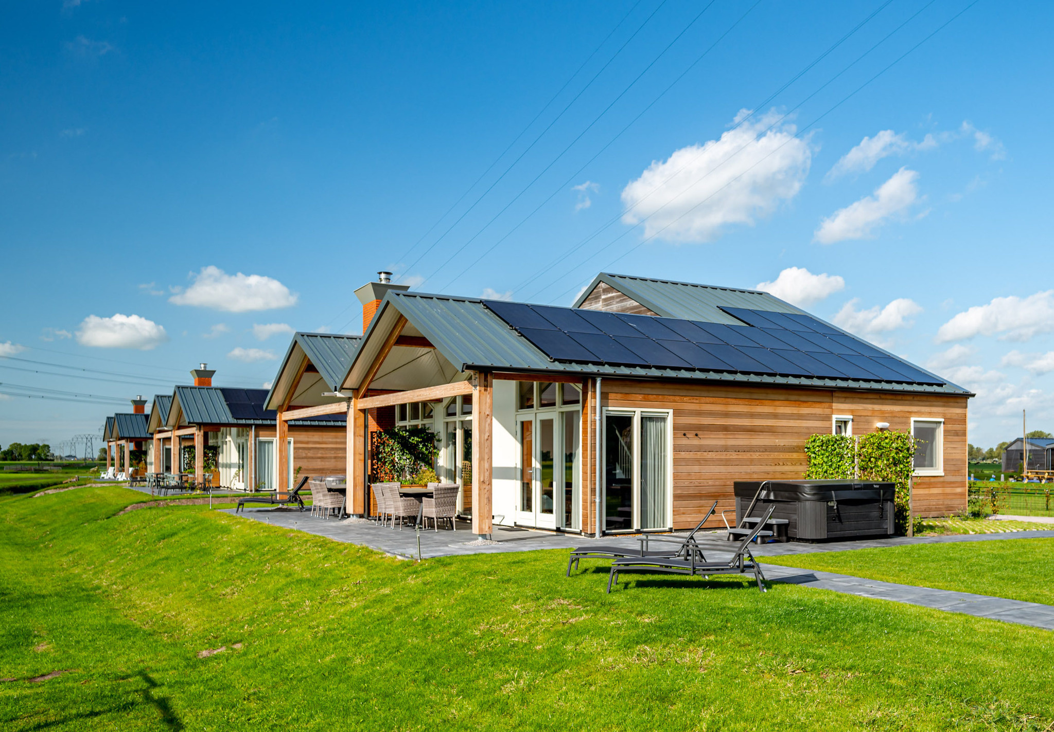 Verblijf in onze Anker 14 Wellness familiewoning mét sauna, buitenspa en sunshower.